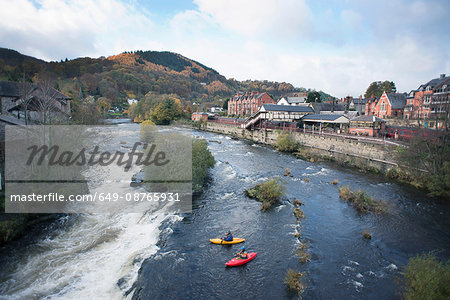 High angle view of two kayakers at the edge  of River Dee rapids, Llangollen, North Wales