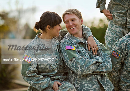 US Army soldiers relax together after a training exercise.