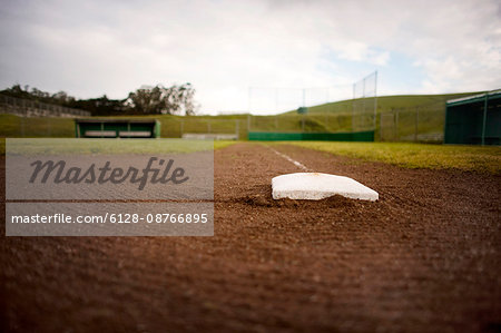 Base in the dirt of a baseball diamond.