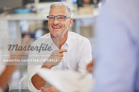 Smiling businessman in meeting