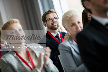 Business people applauding during seminar