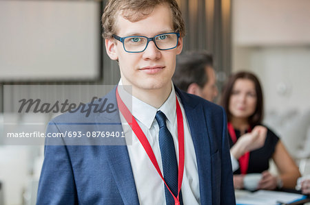 Portrait of confident businessman at lobby in convention center