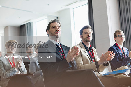 Business people applauding during seminar