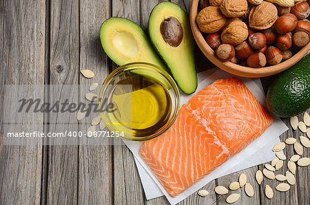 Selection of healthy fat sources. Rustic background. Horizontal permission. Top view. Copy space.