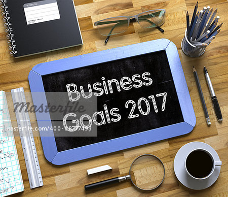 Business Goals 2017 on Small Chalkboard. Business Goals 2017 Handwritten on Blue Small Chalkboard. Top View of Wooden Office Desk with a Lot of Business and Office Supplies on It. 3d Rendering.