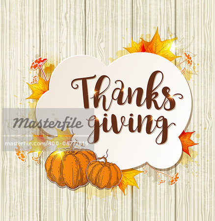 Greeting card for Thanksgiving Day. Lettering, orange pumpkins and maple leaves on a wooden background.