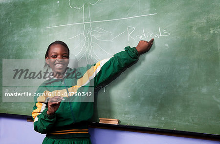 A young girl pointing to a drawing on a blackboard, Meyerton Primary School, Meyerton, Gauteng