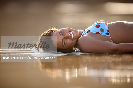 Woman laying on beach