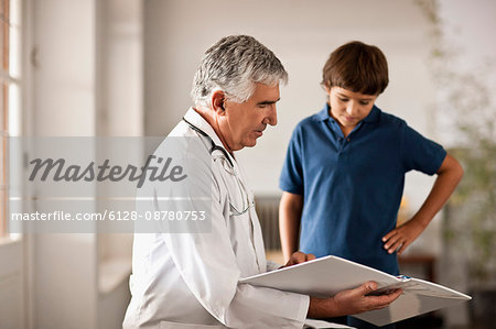 Young boy getting a checkup at the doctor's office.