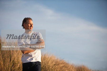 Mature man looking into the distance.