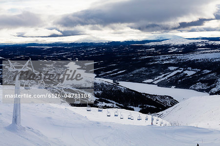 Sweden, Jamtland, Are, Areskutan, Ski slope and ski lift on cloudy day
