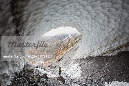 Germany, Bavaria, Schonau am Konigsee, Berchtesgarden, Man standing inside large cave