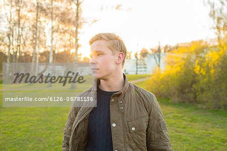 Sweden, Ostergotland, Mjolby, Young blonde man wearing jacket