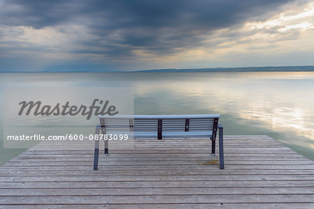 Bench on Wooden Jetty at Sunset at Weiden am See, Lake Neusiedl, Burgenland, Austria