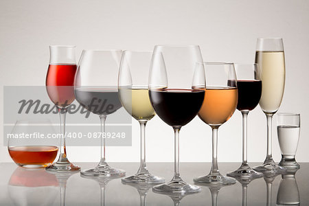Collection of stemware with drinks.