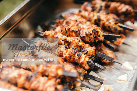 Marinated shashlik lies cooked on a barbecue grill. Shashlik or Shish kebab popular in Eastern Europe.