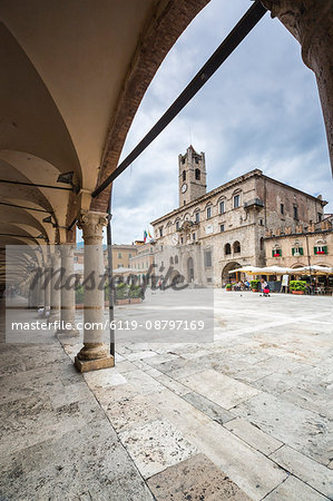 The old arcades frame the historical buildings of Piazza del Popolo, Ascoli Piceno, Marche, Italy, Europe