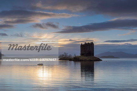 Mid-winter sunset over Loch Linnhe and Castle Stalker in winter, Argyll and Bute, Scotland, United Kingdom, Europe