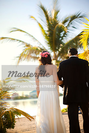 Portrait of a newlywed couple on a tropical beach.
