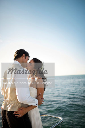 Portrait of a young newlywed couple tenderly embracing after their wedding.