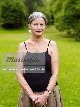 Senior woman standing in park