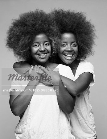 Twin sisters with Afro hair