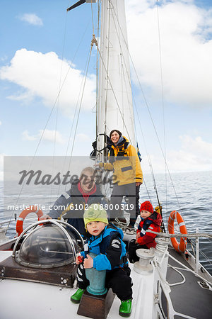 Family on sailing boat, smiling