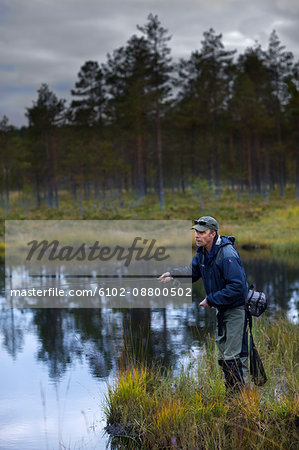 A man fly-fishing, Sweden.