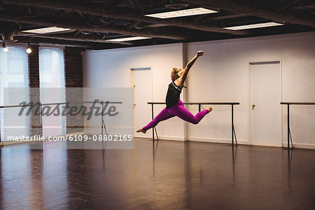 Ballerina practicing ballet dance in the ballet studio