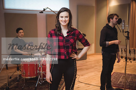 Portrait of beautiful woman smiling in recording studio