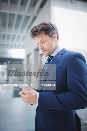 Businessman using mobile phone in office