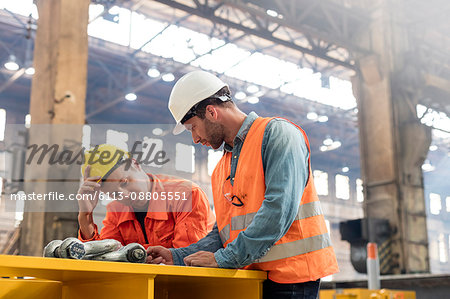 Steel workers meeting in factory
