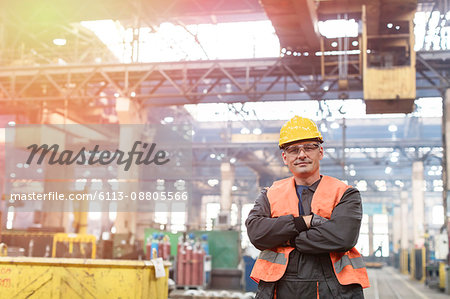 Portrait confident steel worker in factory