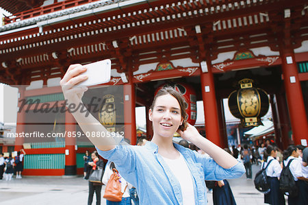 Caucasian woman enjoying sightseeing in Tokyo, Japan