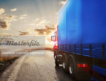 Blue truck on the road with the landscape at sunset  . 3D Rendering