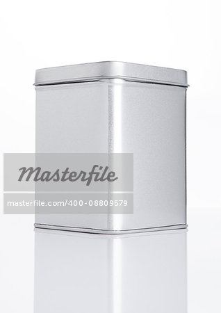 Emty tea steel container jar on white background with reflection