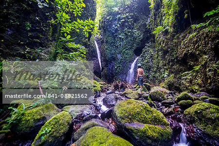 Man looking at the Tafunsak waterfall, Kosrae, Federated States of Micronesia, South Pacific