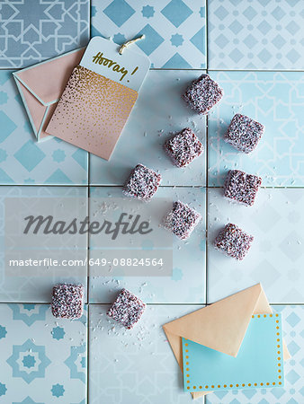 Cubes of sweets on tiles, next to greeting cards