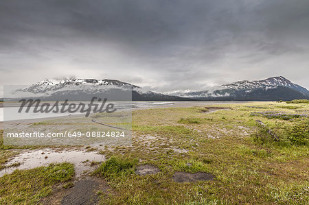 Snow capped mountains across wetlands, Bird Point, Seward Highway, Alaska, USA