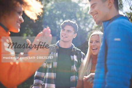 Group of friends chatting and smiling