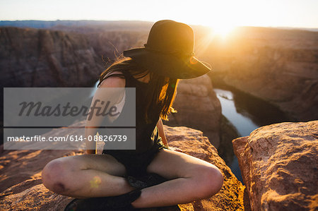 Woman looking sideways at view, Horseshoe Bend, Page, Arizona, USA