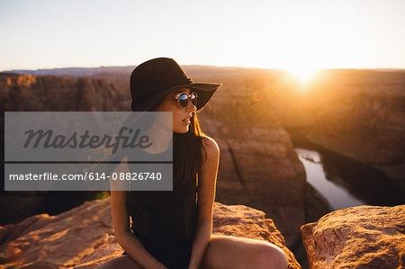 Woman relaxing and enjoying view, Horseshoe Bend, Page, Arizona, USA