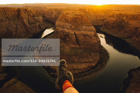 Person relaxing and enjoying view, Horseshoe Bend, Page, Arizona, USA