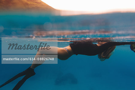 Woman free-diving in sea