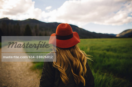 Rear view of woman wearing hat looking away, Rocky Mountain National Park, Colorado, USA