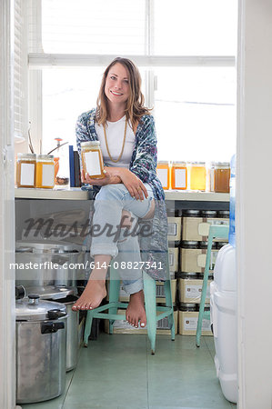 Women holding jar of homemade product