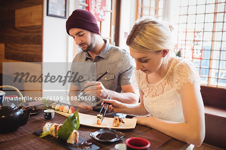 Couple eating sushi