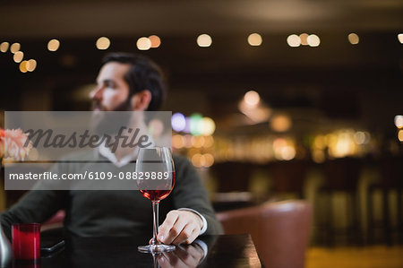 Man sitting with glass of wine