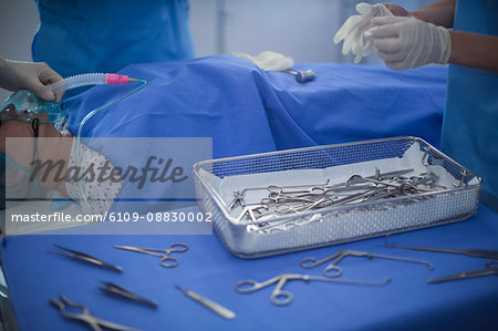 Group of surgeons performing operation in operation room