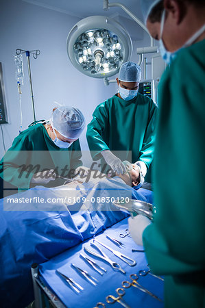 Surgeons performing operation in operation theater